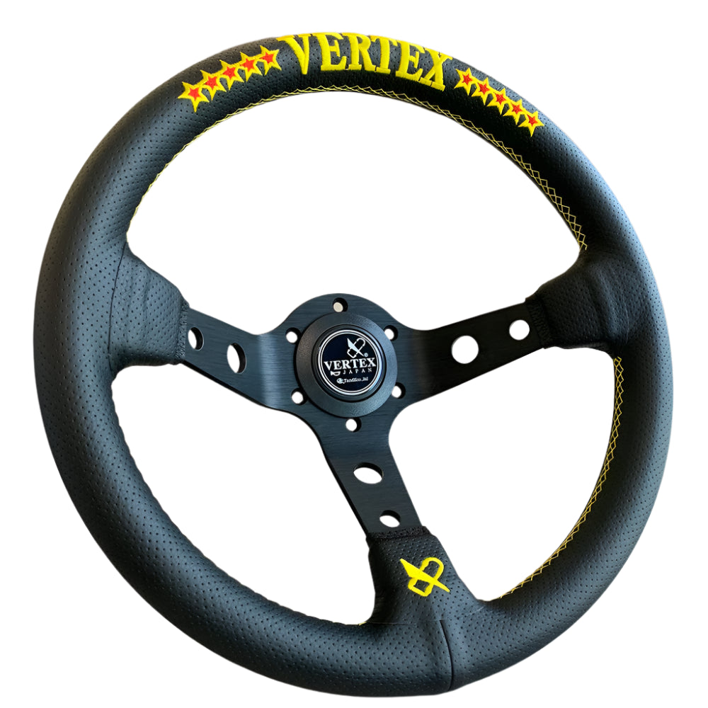 Black Vertex steering wheel with yellow branding on a neutral background