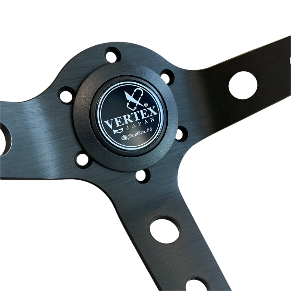Black aluminium centre of steering wheel with Vertex Japan logo