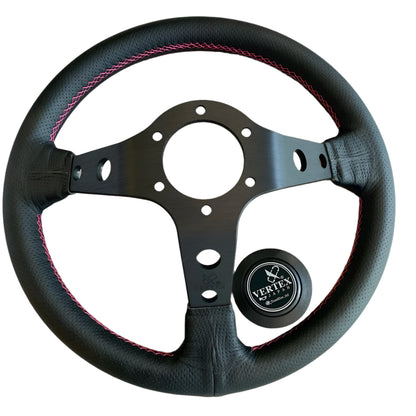 Black steering wheel with pink stitching, featuring the Vertex logo.